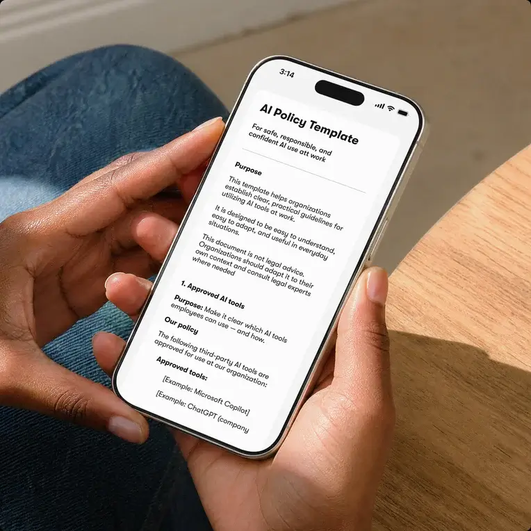 Hands holding a phone that shows an “AI Policy Template” document