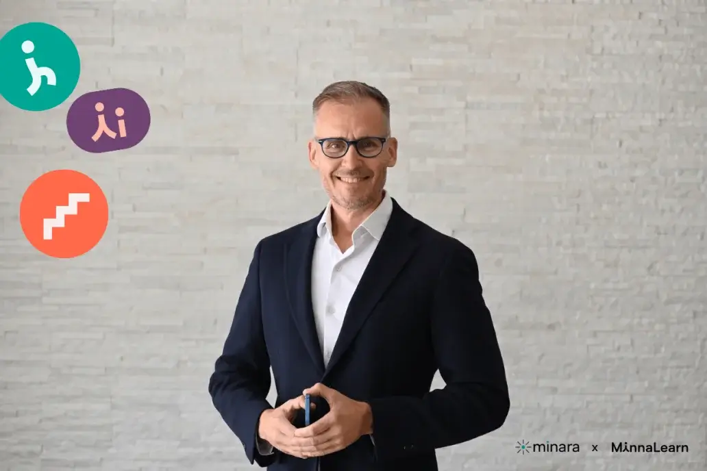 Portrait of a smiling man in a dark suit and glasses, with MinnaLearn and Minara logos